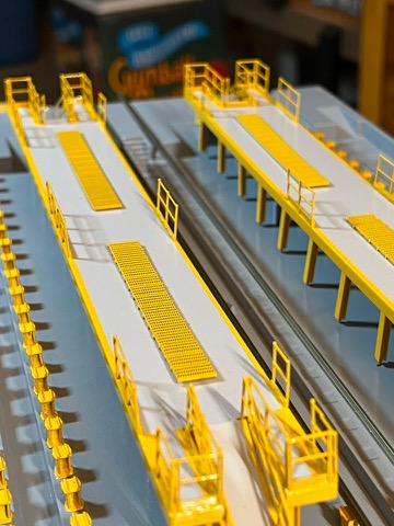 Twin Platforms Grates Track Between